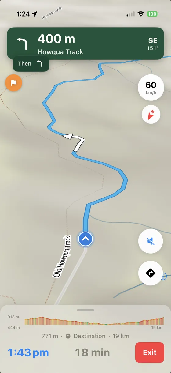 TerraADV turn-by-turn navigation: 400 metres to a left onto Howqua Track, with the next manoeuvre queued, current speed, gradient-coloured elevation strip and an 18 minute ETA.